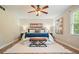 Charming main bedroom featuring ceiling fan, rug, and matching lamps on nightstands at 588 Benson Hurst Sw Dr, Mableton, GA 30126