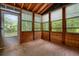 The porch with wood construction features walls of windows and an exterior door at 588 Benson Hurst Sw Dr, Mableton, GA 30126