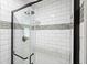 Beautifully tiled shower with glass door and modern fixtures at 588 Benson Hurst Sw Dr, Mableton, GA 30126