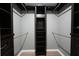 Large walk-in closet with shelving for storage and organization in this home at 588 Benson Hurst Sw Dr, Mableton, GA 30126