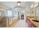 Elegant bathroom featuring double sinks, granite counters, and a glass-enclosed shower offering a luxurious experience at 2630 Weddington Ne Pl, Marietta, GA 30068