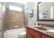 Bathroom features a tiled shower, and vanity with sink and a mirror at 2630 Weddington Ne Pl, Marietta, GA 30068