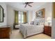 Serene bedroom with a tufted headboard, soft lighting, and elegant curtains creates a relaxing retreat at 2630 Weddington Ne Pl, Marietta, GA 30068