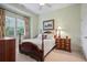 Charming bedroom with four-poster bed, neutral walls, and natural lighting at 2630 Weddington Ne Pl, Marietta, GA 30068