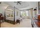 Spacious bedroom with a canopy bed, decorative molding, and large windows offering a tranquil retreat at 2630 Weddington Ne Pl, Marietta, GA 30068
