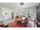 Spacious dining room with hardwood floors, a chandelier, and ample natural light at 2630 Weddington Ne Pl, Marietta, GA 30068