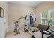 Well-lit exercise room with exercise machines, carpeted flooring, and plantation shutters at 2630 Weddington Ne Pl, Marietta, GA 30068
