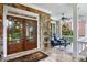Covered front porch with stone accents, featuring seating and a charming double-door entrance at 2630 Weddington Ne Pl, Marietta, GA 30068