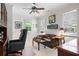 Inviting home office space with a desk, sofa, and shuttered windows at 2630 Weddington Ne Pl, Marietta, GA 30068