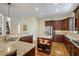 Well-appointed kitchen featuring granite countertops, an island with seating, and ample cabinet space at 2630 Weddington Ne Pl, Marietta, GA 30068