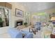 Inviting sunroom features large windows, a stone fireplace, and access to outdoor living spaces at 2630 Weddington Ne Pl, Marietta, GA 30068
