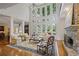 Bright and airy living room featuring a stone fireplace and soaring windows offering picturesque views at 2630 Weddington Ne Pl, Marietta, GA 30068