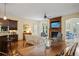Open-concept living area boasts hardwood floors, a cozy fireplace, and seamless access to the kitchen at 2630 Weddington Ne Pl, Marietta, GA 30068
