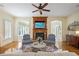 Inviting living room features a stone fireplace, wood floors, and comfortable seating, perfect for relaxing at 2630 Weddington Ne Pl, Marietta, GA 30068