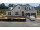 Charming new construction home with a two-car garage, ready for personalization at 313 Willow Cv, Canton, GA 30114