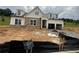 Charming two-story home with stone accents, dormer windows, and an attached two-car garage at 313 Willow Cv, Canton, GA 30114
