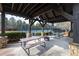 Picturesque picnic area offers covered tables and a fire pit near the community tennis courts at 313 Willow Cv, Canton, GA 30114