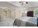 Large bedroom with carpet, windows, and ceiling fans at 4507 Reva Way, Marietta, GA 30066