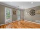 Sun-filled bonus room with hardwood floors, multiple windows, crown moulding, and wall decor at 4507 Reva Way, Marietta, GA 30066