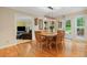 Charming dining room with hardwood floors, garden views, and a doorway to the sun-lit living room at 4507 Reva Way, Marietta, GA 30066