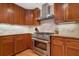 Gourmet kitchen with wood cabinets, stainless steel appliances, and granite countertops provide ample food preparation space at 4507 Reva Way, Marietta, GA 30066