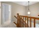 Staircase with wooden handrail and neutral-toned carpet at 4507 Reva Way, Marietta, GA 30066