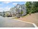 Two-story townhome features a private, covered porch and a two-car garage at 507 Bishop Ln, Woodstock, GA 30188