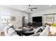 Well-lit living room features stylish decor, a ceiling fan, and a comfortable seating area at 507 Bishop Ln, Woodstock, GA 30188