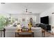 Bright and airy living room with a ceiling fan, neutral decor and large windows offering an abundance of natural light at 507 Bishop Ln, Woodstock, GA 30188