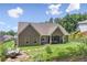 Spacious backyard with a patio, stone walkway, and well-maintained landscaping at 59 Grand Georgian Ne Ct, Cartersville, GA 30121