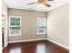 This bedroom features hardwood floors, two windows, and white trim at 59 Grand Georgian Ne Ct, Cartersville, GA 30121