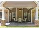 Inviting covered patio with ceiling fan and outdoor dining set, perfect for relaxation at 59 Grand Georgian Ne Ct, Cartersville, GA 30121