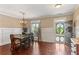 Bright dining area featuring wainscoting, hardwood floors, and ample natural light at 59 Grand Georgian Ne Ct, Cartersville, GA 30121