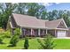 Well-maintained home with lush landscaping, a cozy front porch, and a two-car garage, offering a warm and welcoming atmosphere at 59 Grand Georgian Ne Ct, Cartersville, GA 30121