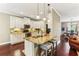 Modern kitchen featuring granite countertops, an island with seating, and stainless steel appliances at 59 Grand Georgian Ne Ct, Cartersville, GA 30121
