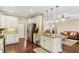 Bright kitchen with stainless steel appliances, granite countertops, and hardwood floors at 59 Grand Georgian Ne Ct, Cartersville, GA 30121