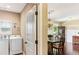 Convenient laundry area adjacent to the dining room with washer and dryer, and hardwood flooring at 59 Grand Georgian Ne Ct, Cartersville, GA 30121