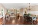 Spacious open-concept living area with hardwood floors, flowing seamlessly into the dining and kitchen spaces at 59 Grand Georgian Ne Ct, Cartersville, GA 30121