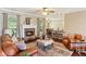Cozy living room with a stone fireplace and an open layout, blending comfort with a touch of rustic elegance at 59 Grand Georgian Ne Ct, Cartersville, GA 30121