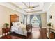 Serene main bedroom boasts hardwood floors and a tray ceiling, creating a peaceful retreat at 59 Grand Georgian Ne Ct, Cartersville, GA 30121