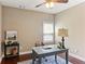 The office features hardwood floors and a desk with a lamp at 59 Grand Georgian Ne Ct, Cartersville, GA 30121