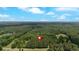Overhead shot of a wooded lot with a marker, revealing a private oasis perfect for building your dream home at 712 Honeysuckle Ln, Temple, GA 30179