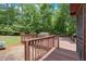 A backyard deck area overlooking a wooded landscape at 712 Honeysuckle Ln, Temple, GA 30179