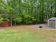 This property features a level backyard and multiple storage sheds at 712 Honeysuckle Ln, Temple, GA 30179