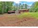 Well-maintained backyard with a spacious deck and ample green space at 712 Honeysuckle Ln, Temple, GA 30179