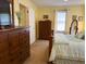 Bright bedroom with a large window, a wooden dresser and a bed at 712 Honeysuckle Ln, Temple, GA 30179