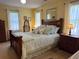 Bedroom featuring furniture with light trim and a bed with decorative pillows at 712 Honeysuckle Ln, Temple, GA 30179