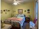 Charming bedroom with floral bedding, decorative touches, and natural light at 712 Honeysuckle Ln, Temple, GA 30179