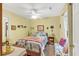 Charming bedroom features a cozy bed, floral accents, and natural light at 712 Honeysuckle Ln, Temple, GA 30179