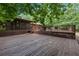 Large wooden deck area with a screened porch for relaxation and outdoor living at 712 Honeysuckle Ln, Temple, GA 30179